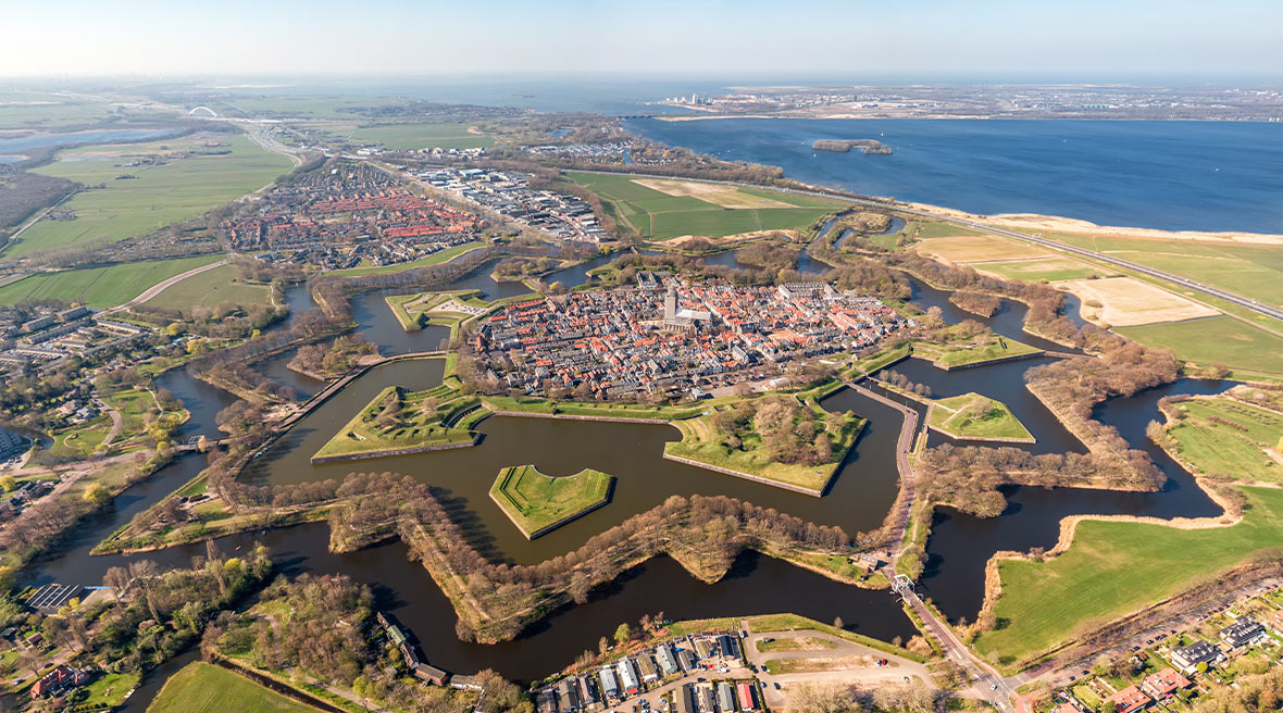 Aerial image of the star shaped medieval Naarden Fortress village in the Netherlands with defence walls and canals